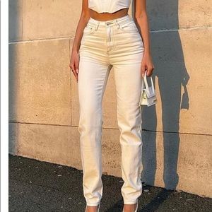 Cream colored straight leg denim jeans